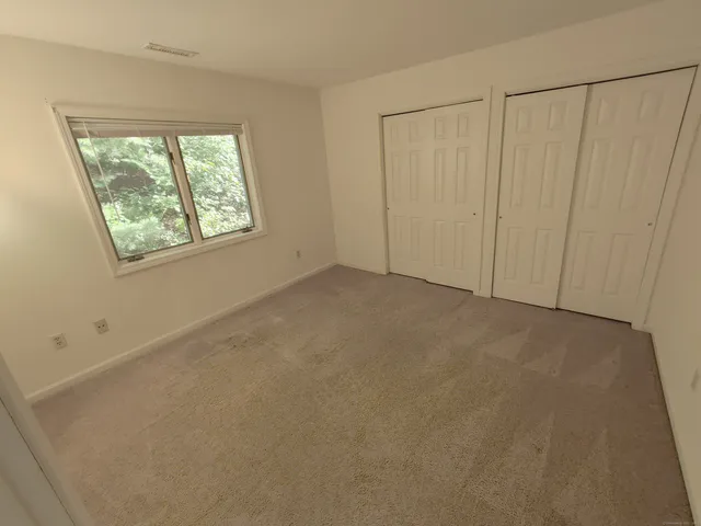 a view of lake with green space