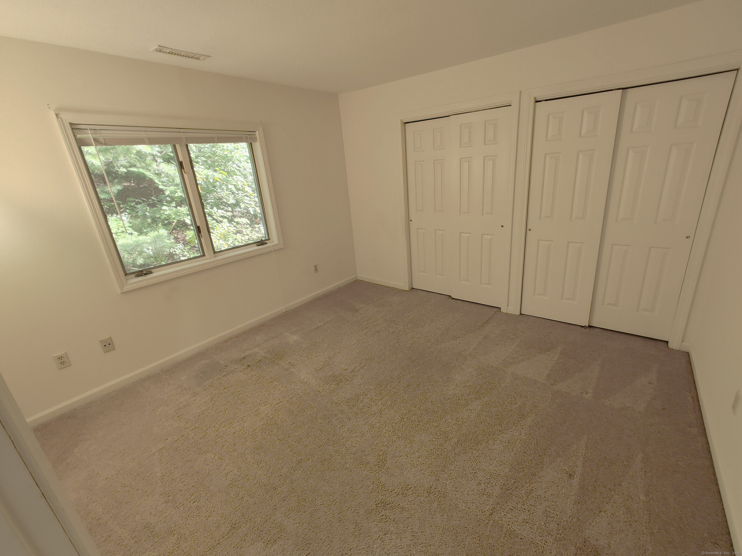 402 Whetstone Mills, Unit 402 Dayville, CT 06241 - Photo 16 of 21 a view of an empty room with a window