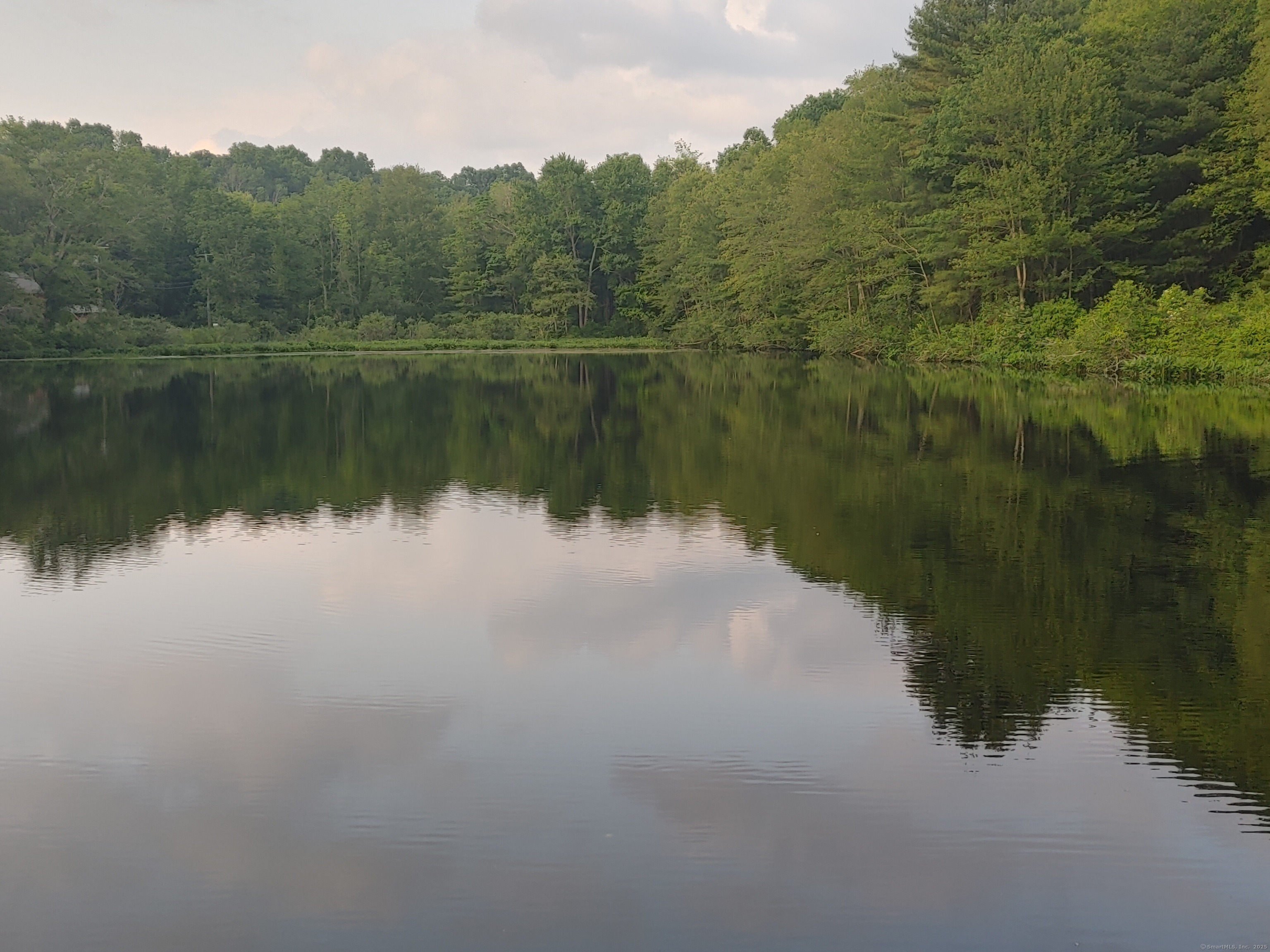 402 Whetstone Mills, Unit 402 Dayville, CT 06241 - Photo 19 of 21 a view of lake with green space