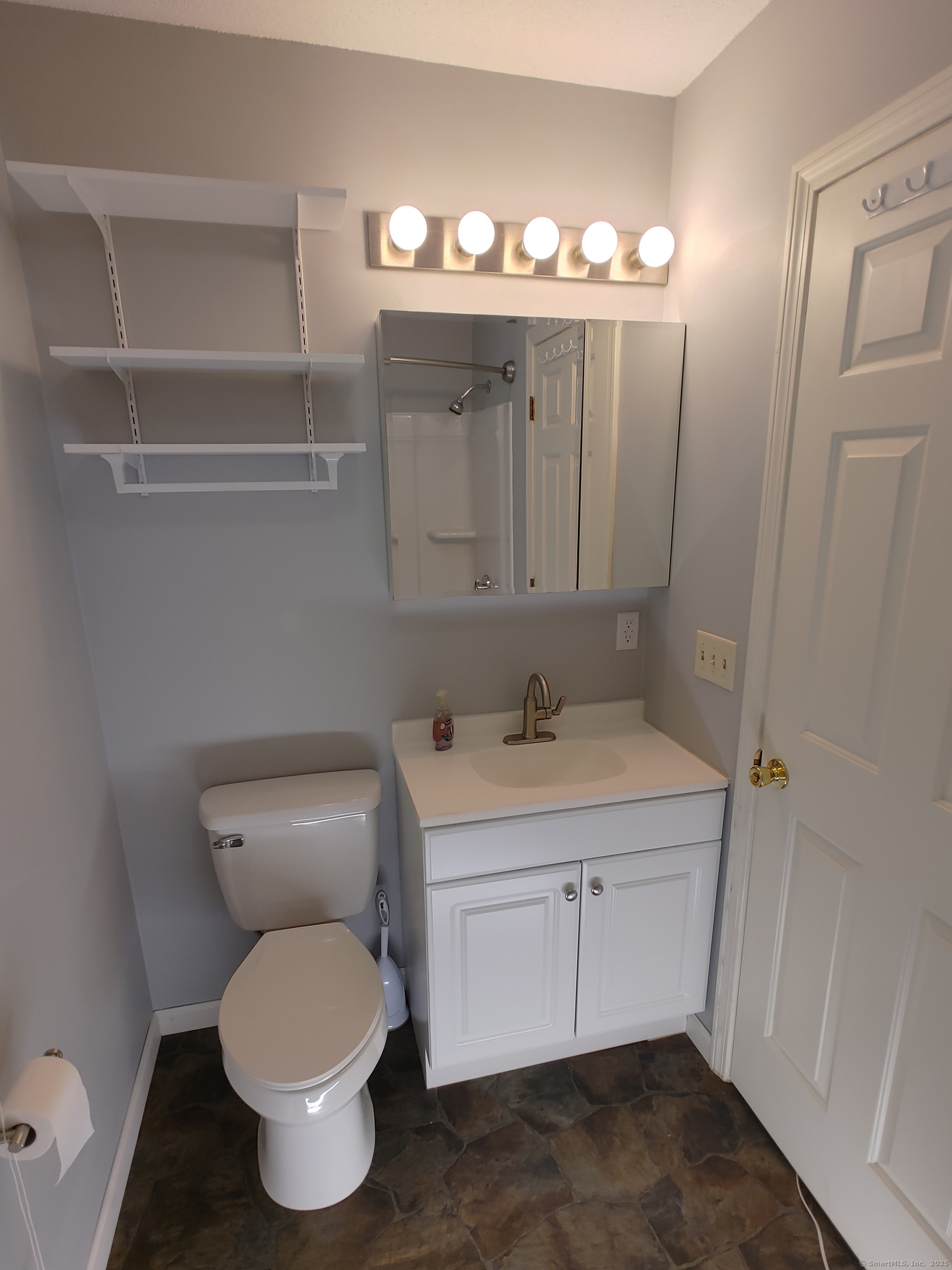 402 Whetstone Mills, Unit 402 Dayville, CT 06241 - Photo 10 of 21 a bathroom with a toilet sink and mirror