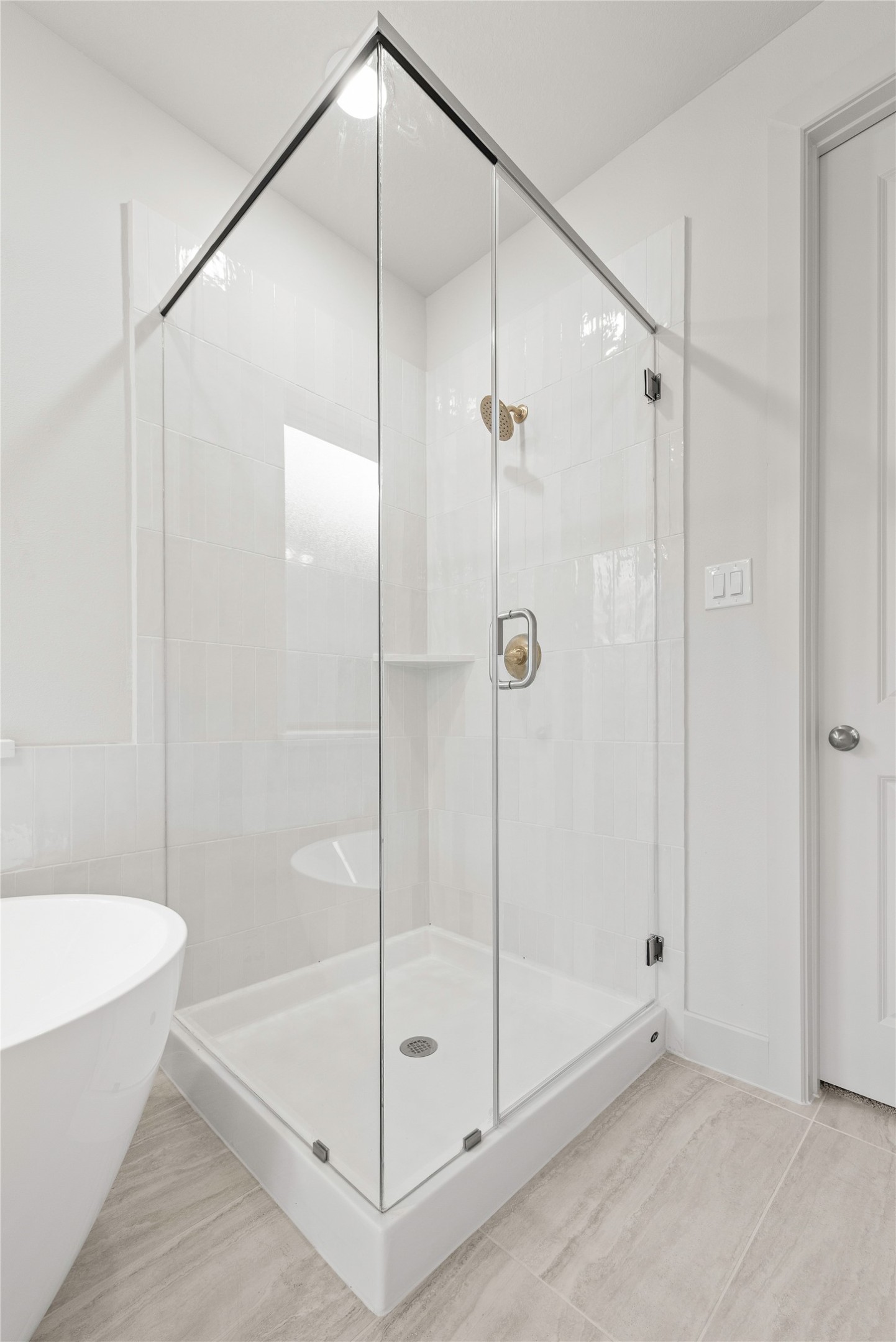 206 Sierra Stream Lane Conroe, TX 77304 - Photo 11 of 28 a bathroom that has a glass shower door