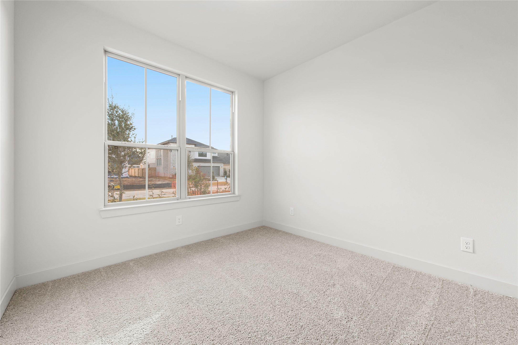 206 Sierra Stream Lane Conroe, TX 77304 - Photo 12 of 28 a view of an empty room with a window