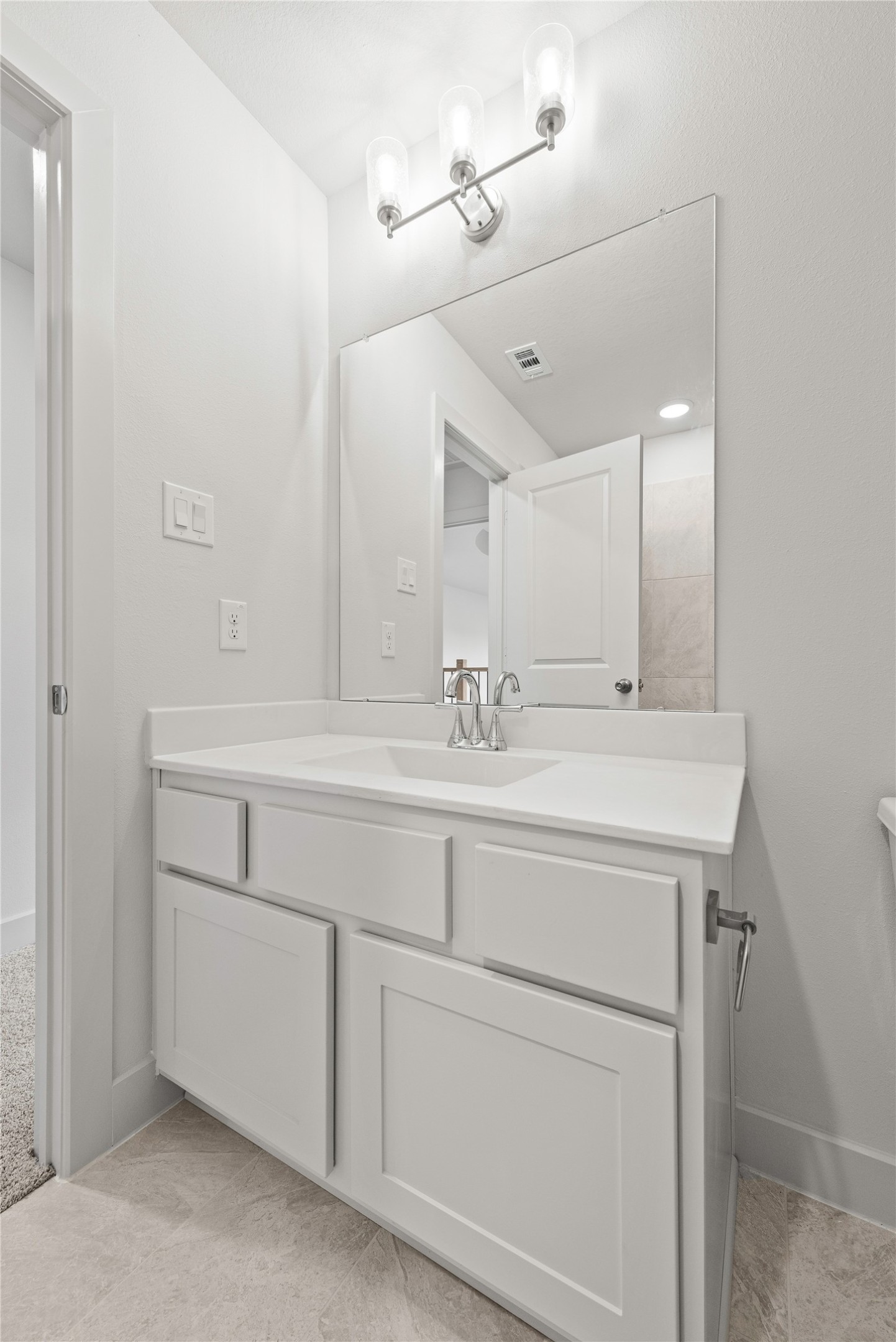 206 Sierra Stream Lane Conroe, TX 77304 - Photo 15 of 28 a bathroom with a sink and a mirror