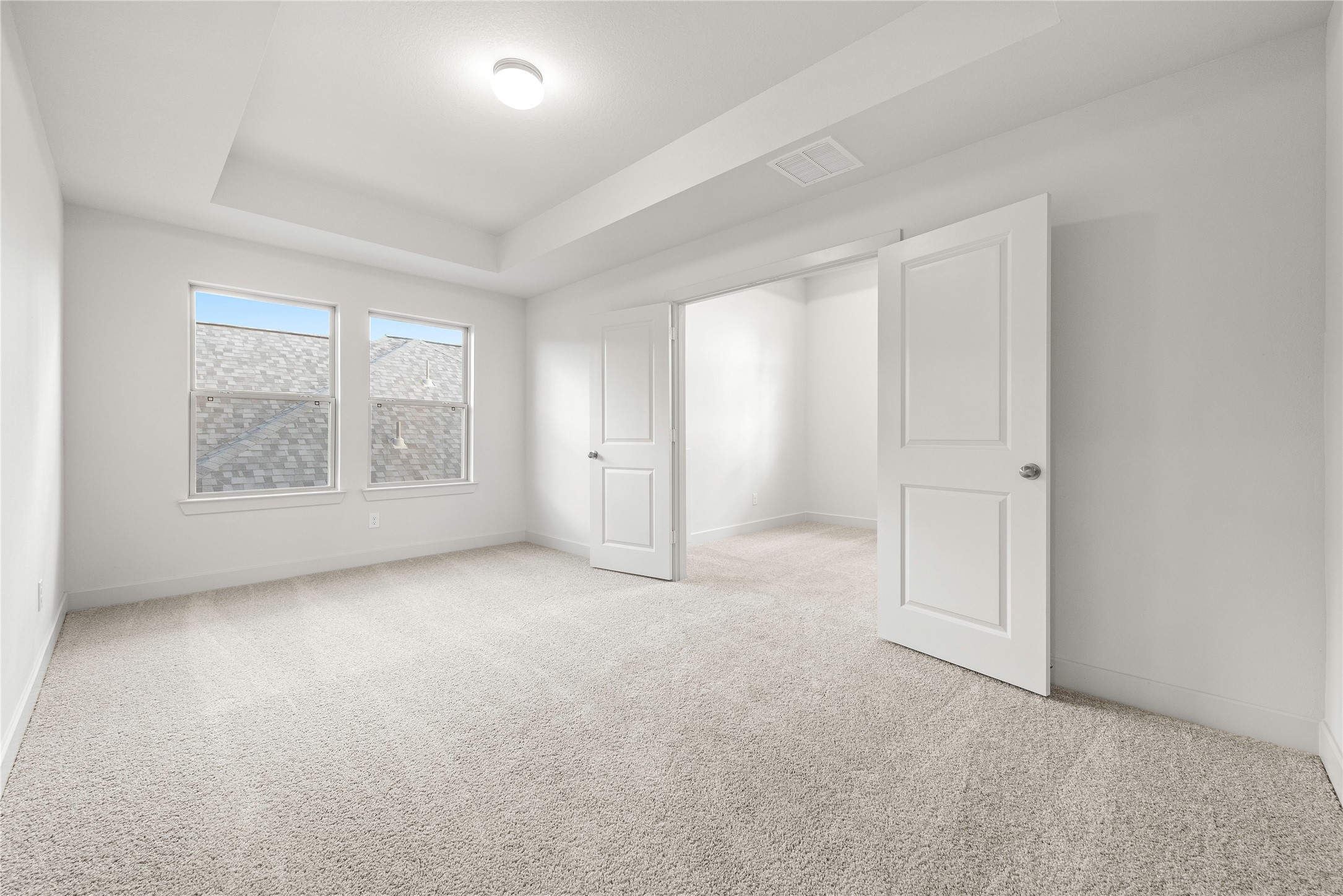 206 Sierra Stream Lane Conroe, TX 77304 - Photo 16 of 28 an empty room with windows and closet