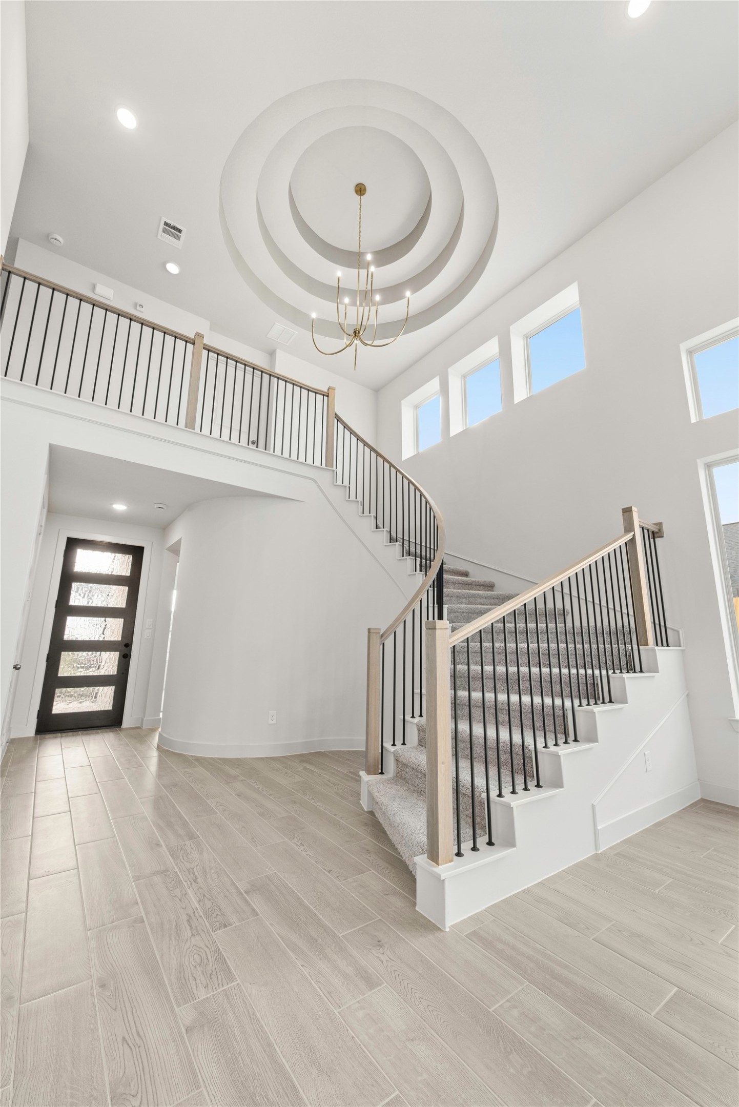 206 Sierra Stream Lane Conroe, TX 77304 - Photo 2 of 28 a view of a hallway with entryway and stairs