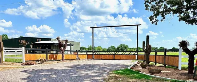 a view of a swimming pool with a patio and a yard