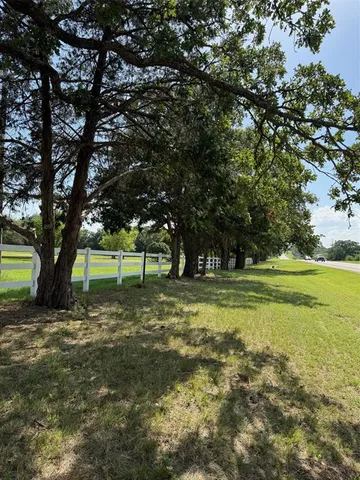 a view of a garage with wooden table and a chair