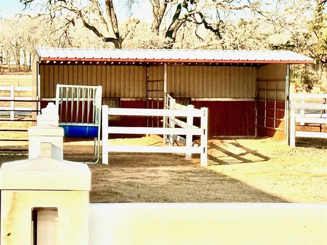 a view of an swimming pool with a yard