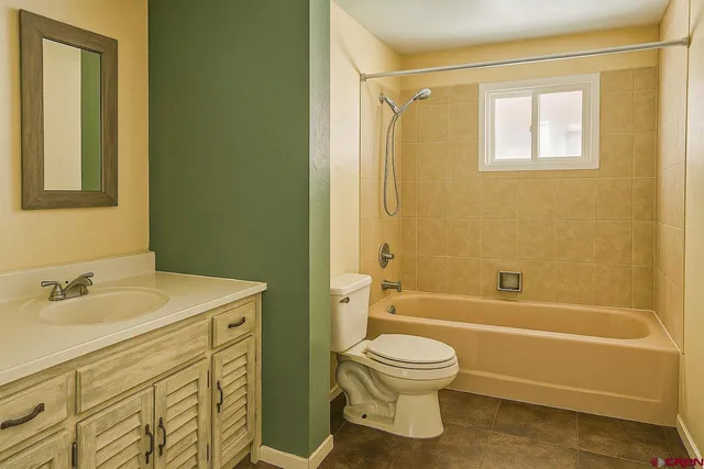 a bedroom with a bed and glass window
