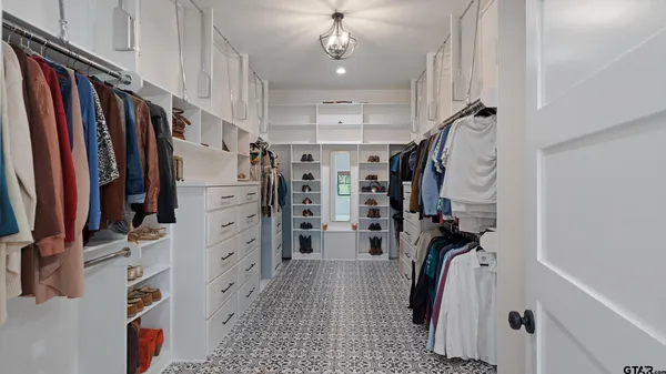 a bedroom with furniture and a wooden floor