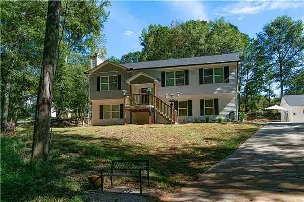 a front view of a house with a yard