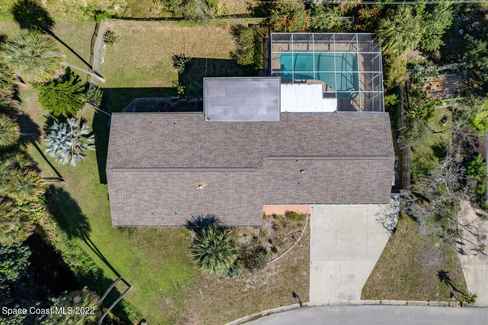 216 Dubber Road Melbourne, FL 32901 - Photo 1 of 39 an aerial view of a house with a yard and large tree
