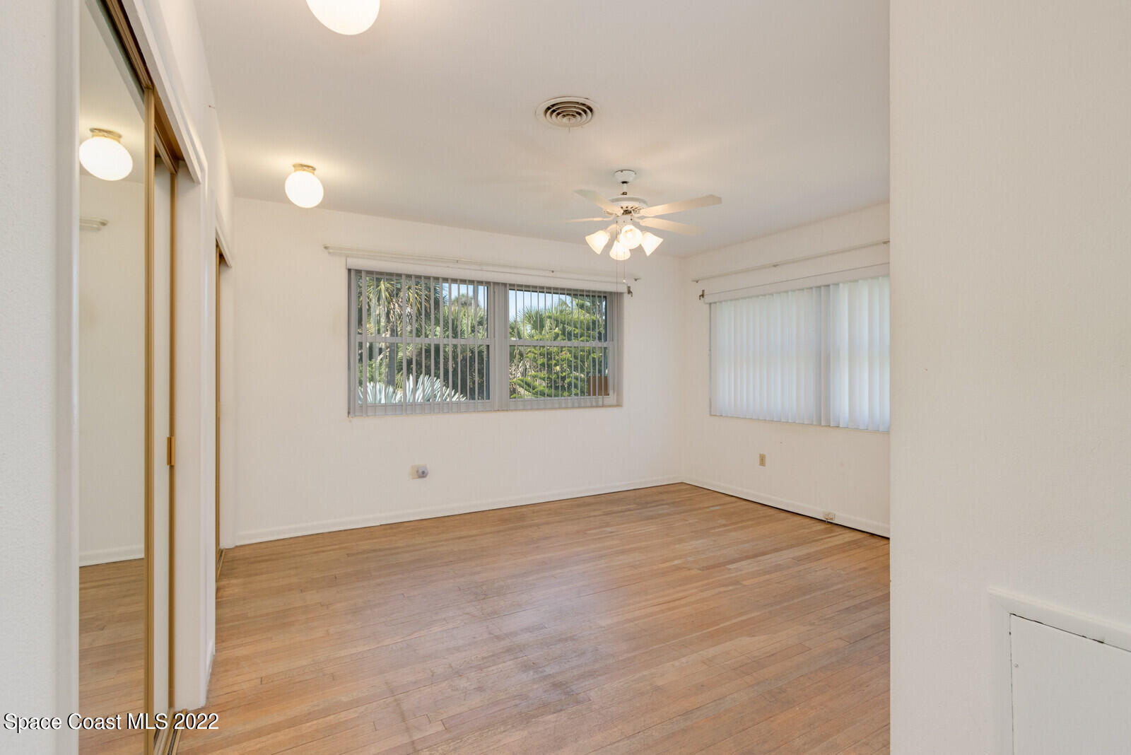 216 Dubber Road Melbourne, FL 32901 - Photo 11 of 39 an empty room with windows and closet