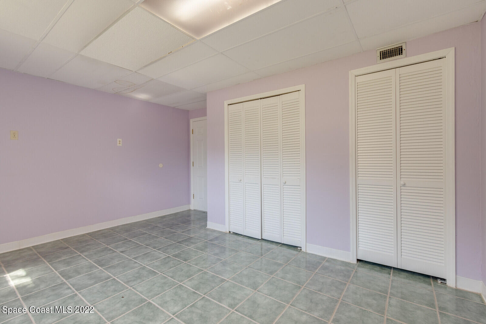 216 Dubber Road Melbourne, FL 32901 - Photo 21 of 39 an empty room with a entrance to ceiling window