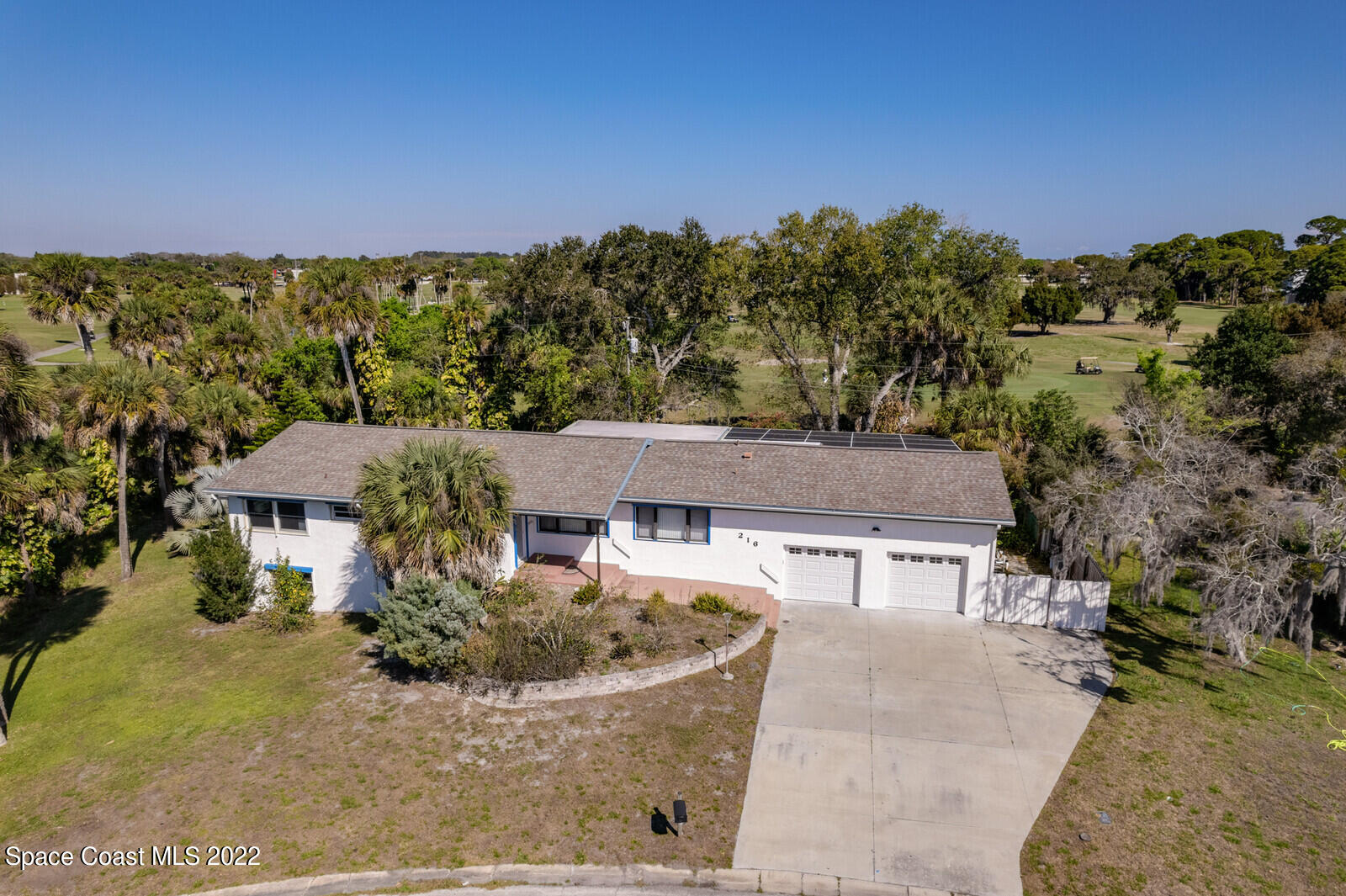 216 Dubber Road Melbourne, FL 32901 - Photo 3 of 39 a view of a house with a yard and sitting area