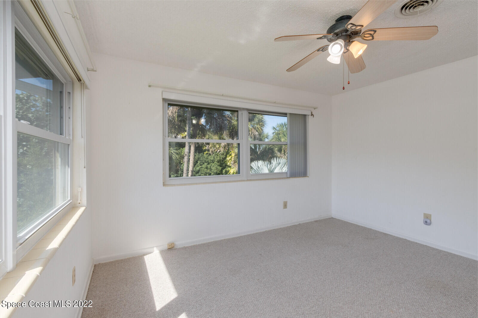 216 Dubber Road Melbourne, FL 32901 - Photo 32 of 39 a view of room with window and ceiling fan