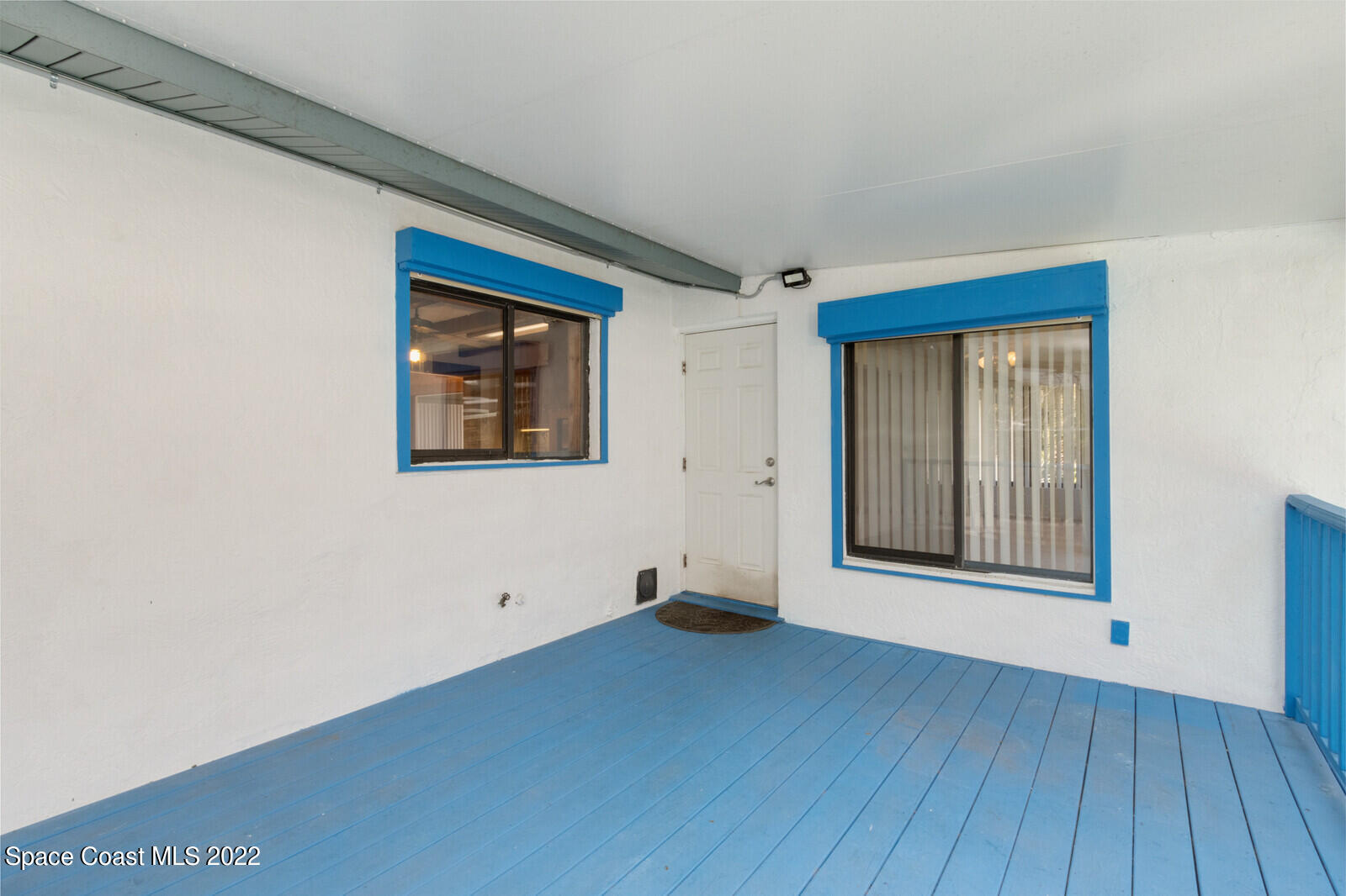 216 Dubber Road Melbourne, FL 32901 - Photo 39 of 39 a view of an empty room with wooden floor and a window