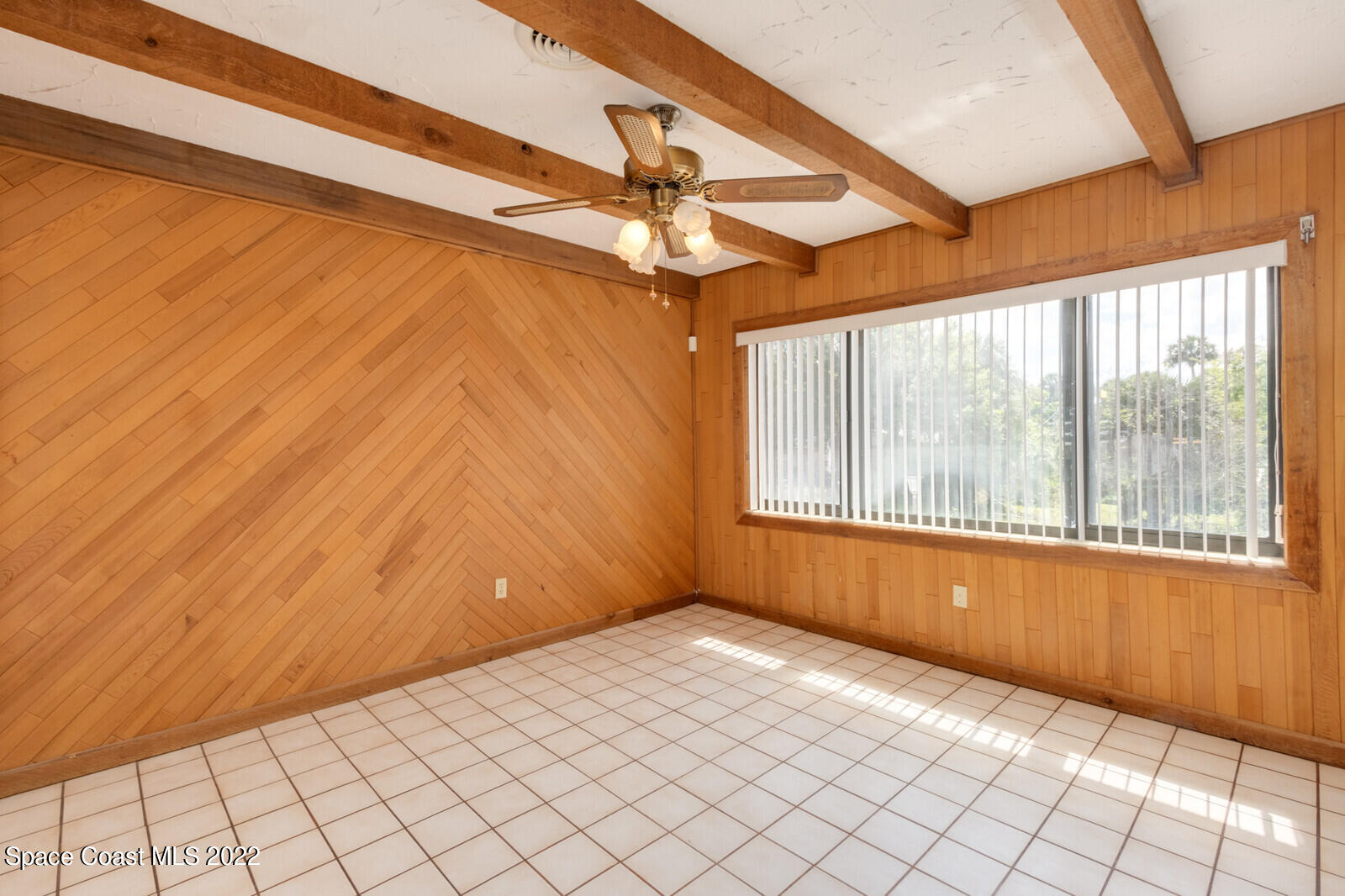 216 Dubber Road Melbourne, FL 32901 - Photo 8 of 39 a view of an empty room with a window