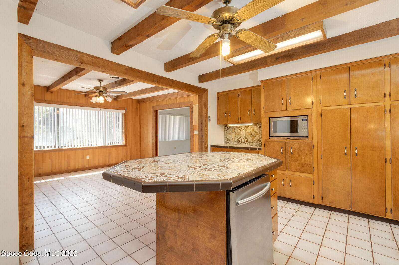 216 Dubber Road Melbourne, FL 32901 - Photo 10 of 39 a kitchen with stainless steel appliances granite countertop a sink and a refrigerator