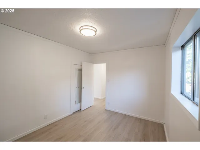 a view of an empty room with a window