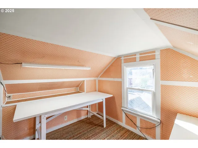 a view of a bedroom from a hallway