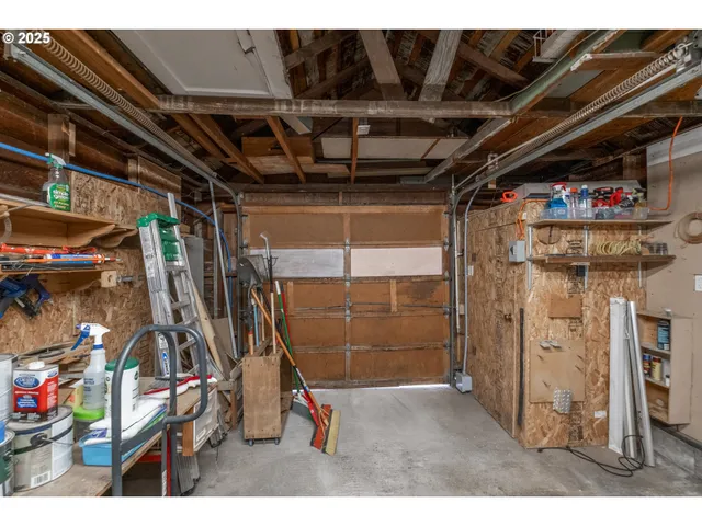 a living room with lots of furniture and clutter