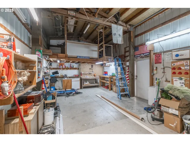 a view of road and shops