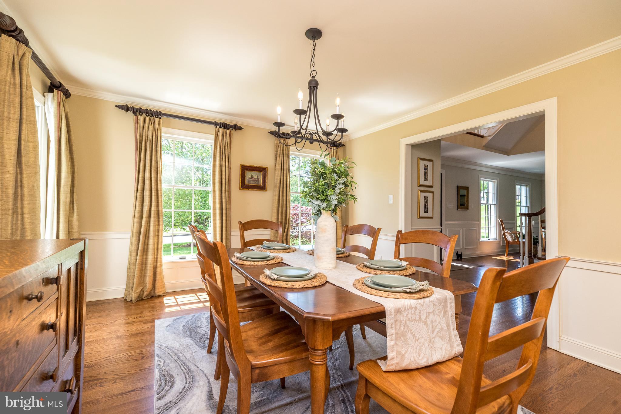 4976 Gloucester Drive Doylestown, PA 18902 - Photo 11 of 68 a view of a dining room with furniture wooden floor and chandelier