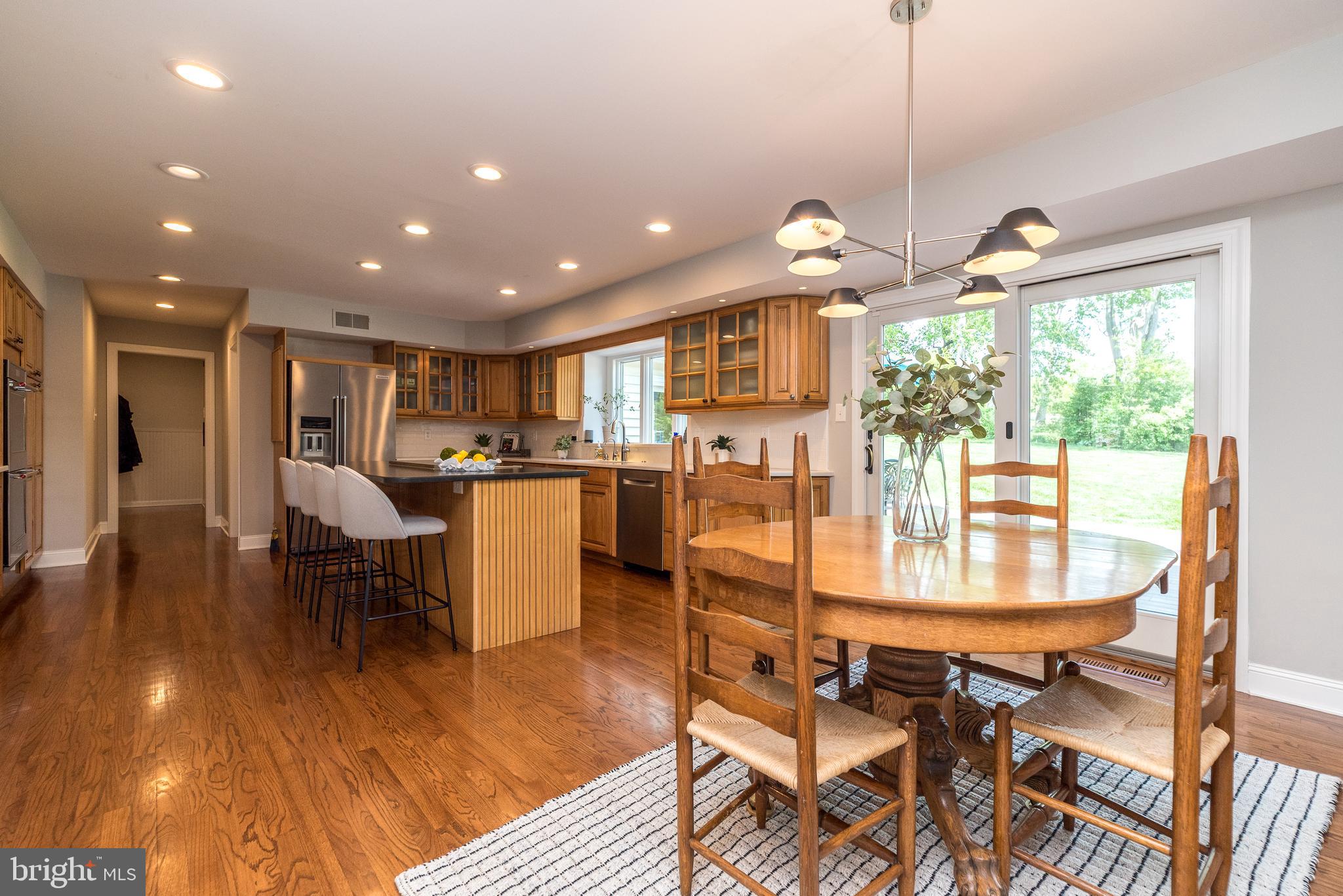 4976 Gloucester Drive Doylestown, PA 18902 - Photo 13 of 68 a view of a dining room with furniture window and wooden floor