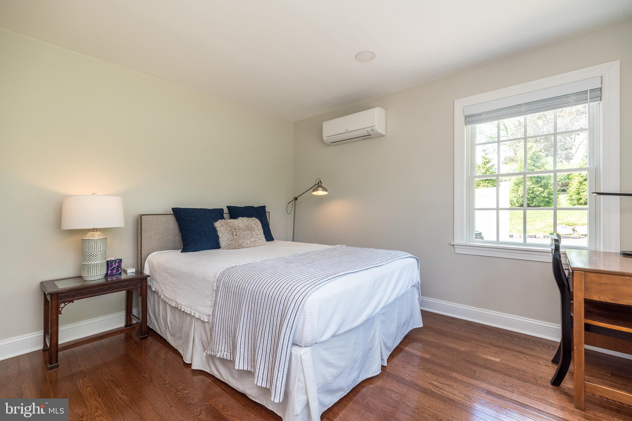 4976 Gloucester Drive Doylestown, PA 18902 - Photo 30 of 68 a bedroom with a bed and a table