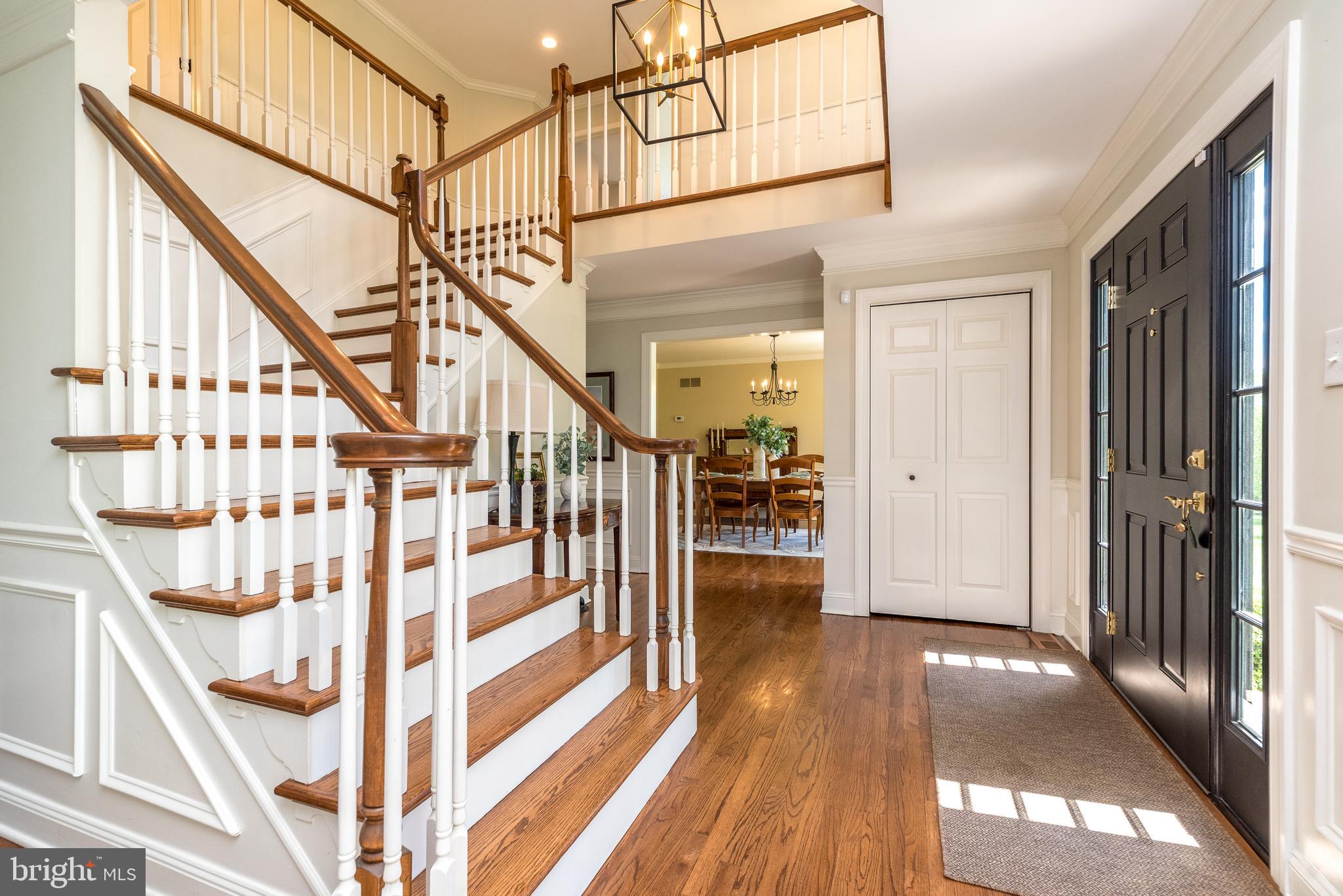 4976 Gloucester Drive Doylestown, PA 18902 - Photo 5 of 68 a view of entryway with wooden floor and stairs