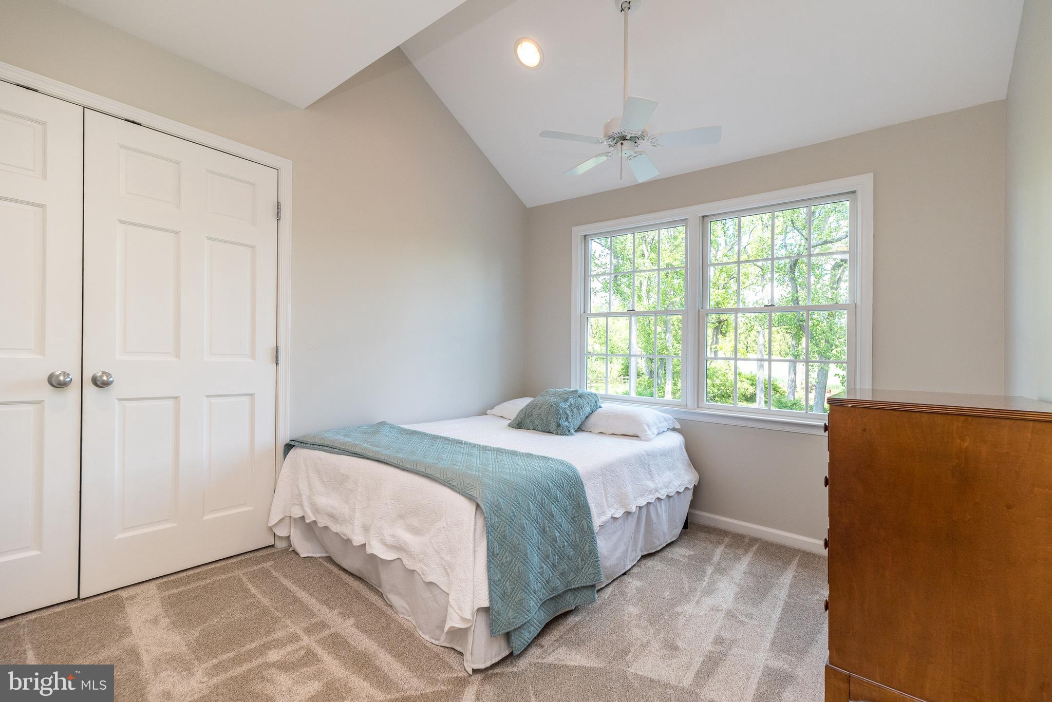 4976 Gloucester Drive Doylestown, PA 18902 - Photo 52 of 68 a bedroom with a bed and a window