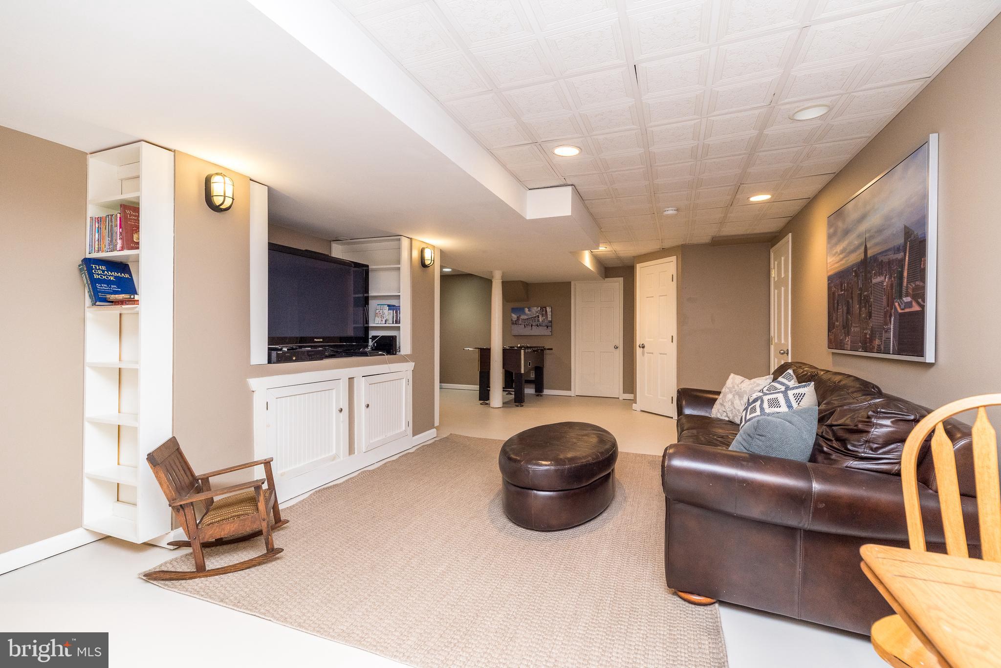 4976 Gloucester Drive Doylestown, PA 18902 - Photo 57 of 68 a living room with furniture and a flat screen tv