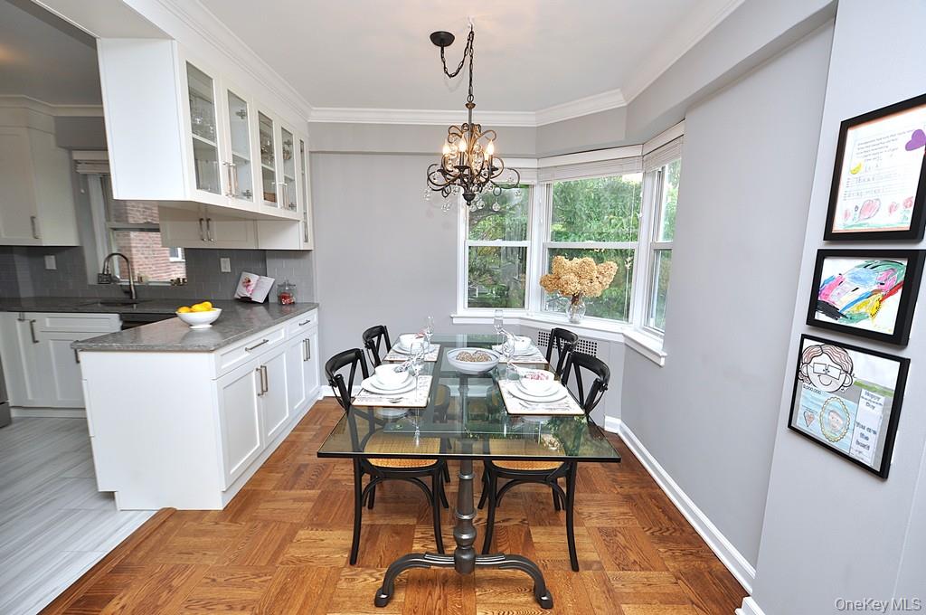 235 Garth Road, Unit E2E Scarsdale, NY 10583 - Photo 15 of 46 The dining area has a bay window and opens to both the living room and renovated kitchen. The dining room is approx 9'-0" x 8'-10"
