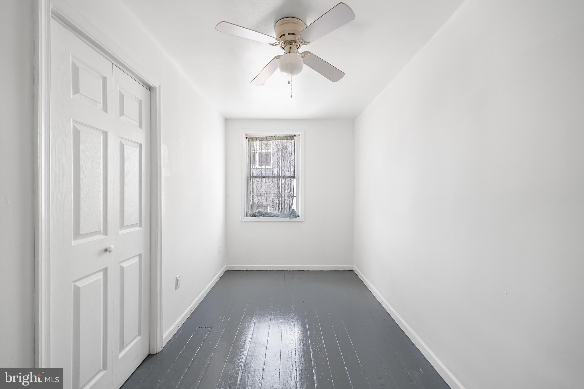 1615 North Philip Street Philadelphia, PA 19122 - Photo 11 of 22 wooden floor in an empty room with a window