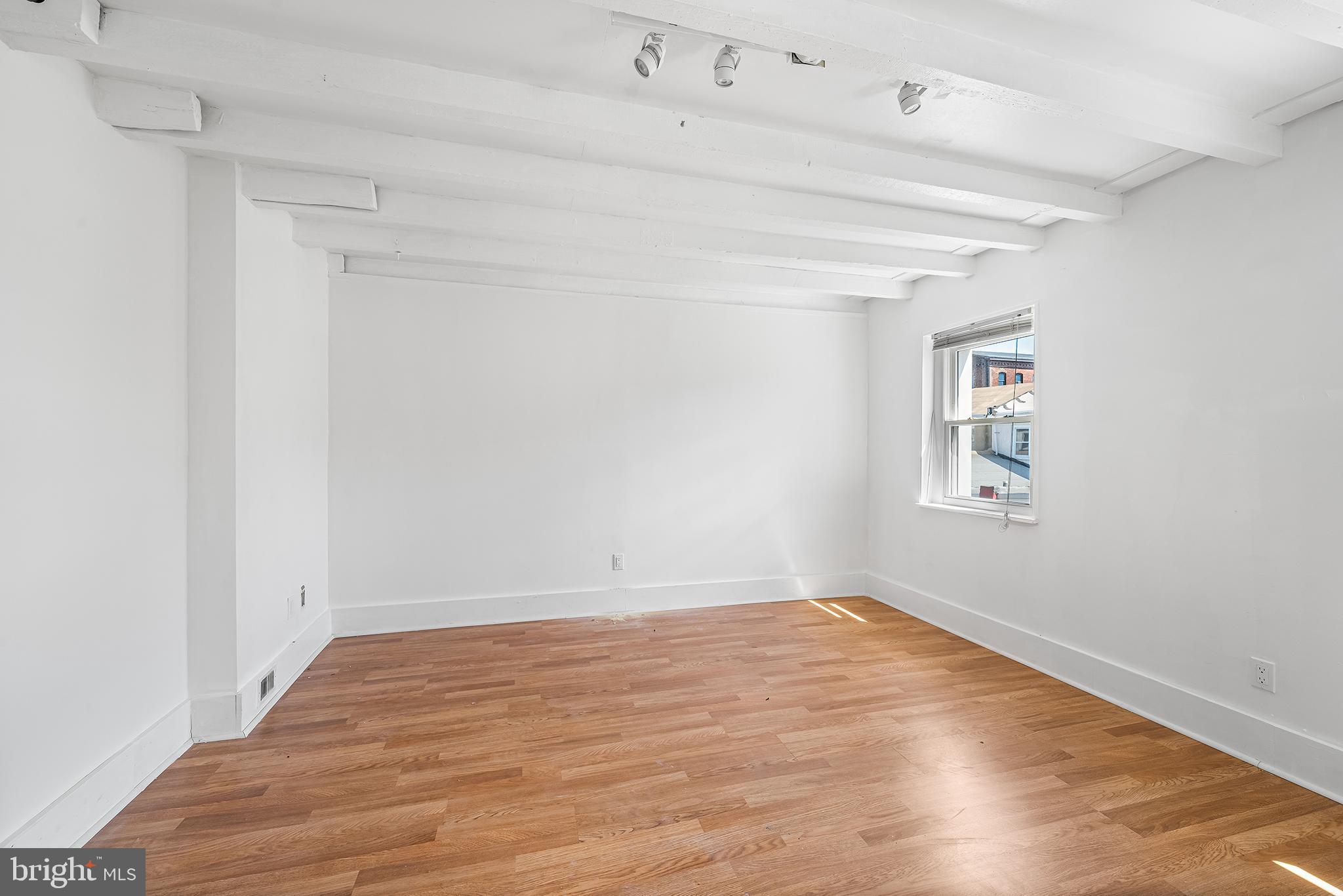 1615 North Philip Street Philadelphia, PA 19122 - Photo 17 of 22 wooden floor in an empty room