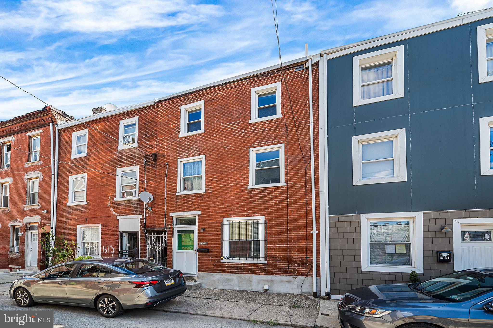 1615 North Philip Street Philadelphia, PA 19122 - Photo 22 of 22 a car parked in front of a brick building
