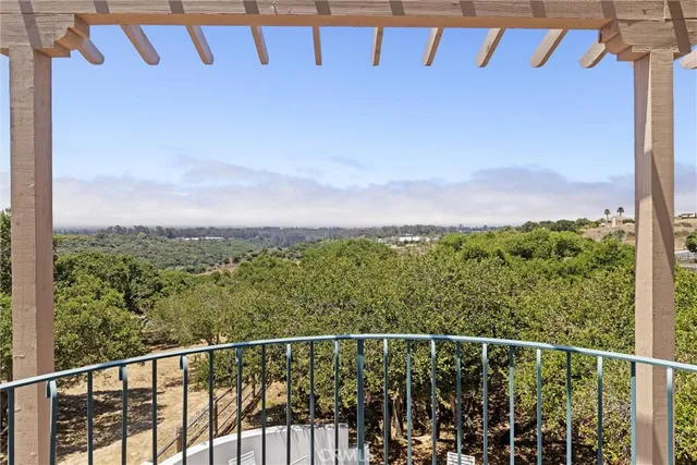 a view of a yard with wooden fence