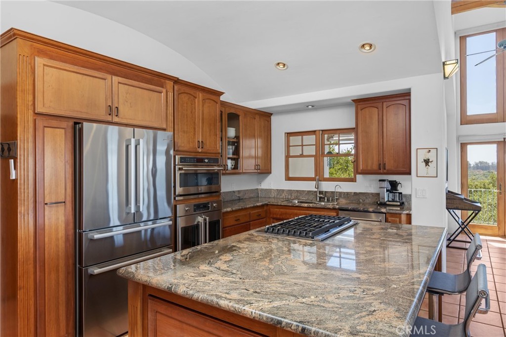 1790 Calle Laguna Arroyo Grande, CA 93420 - Photo 18 of 53 a kitchen with stainless steel appliances granite countertop a sink refrigerator and microwave