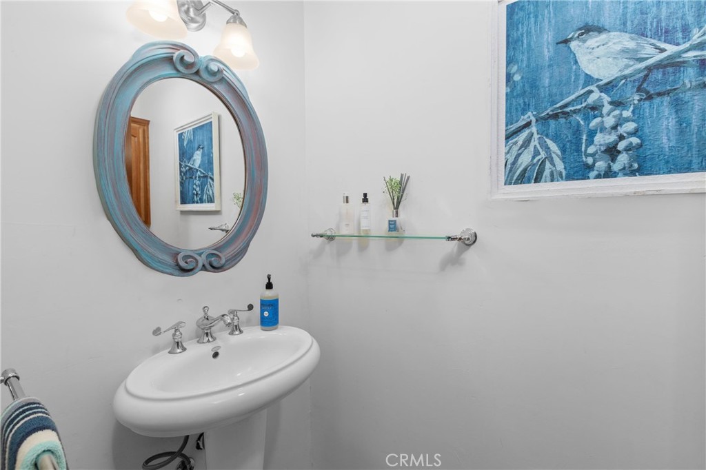 1790 Calle Laguna Arroyo Grande, CA 93420 - Photo 24 of 53 a bathroom with a sink and a mirror