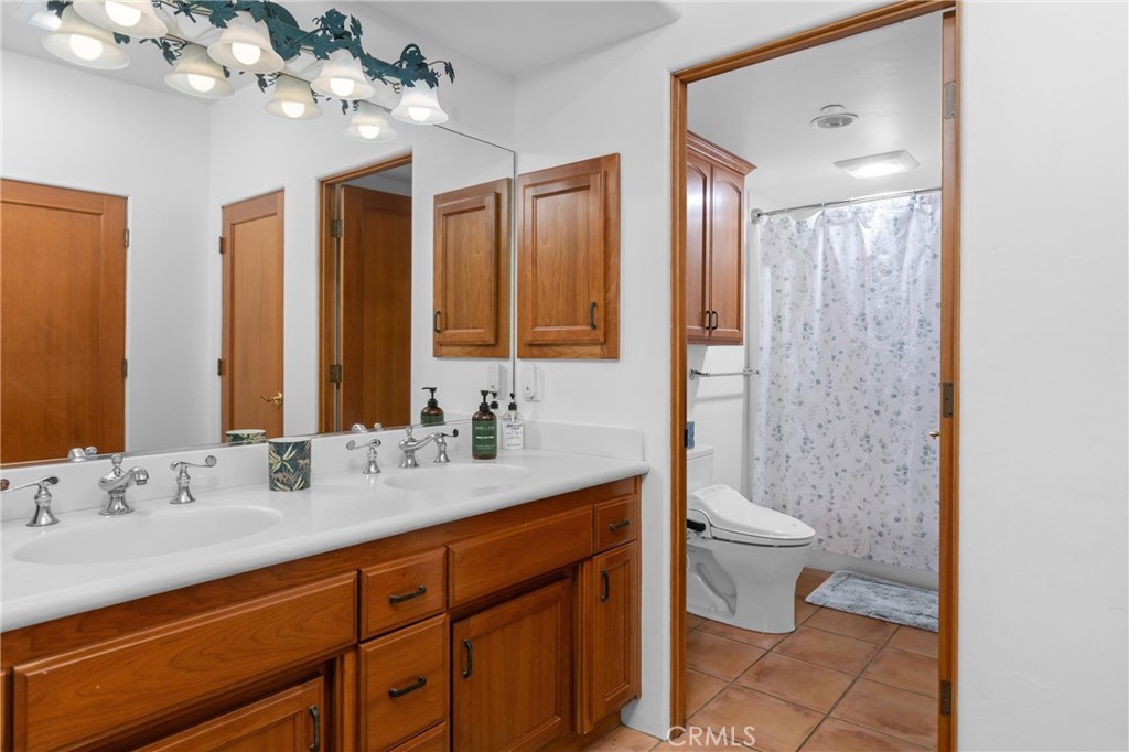 1790 Calle Laguna Arroyo Grande, CA 93420 - Photo 44 of 53 a bathroom with a double vanity sink mirror and toilet