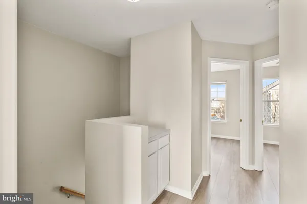 a view of an entryway with wooden floor