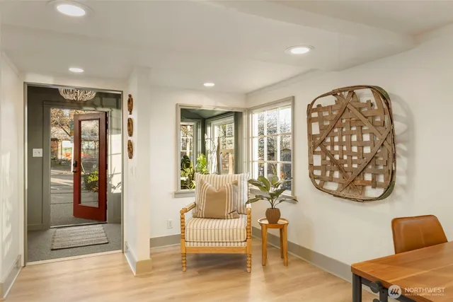 a view of a dining room with furniture and a window