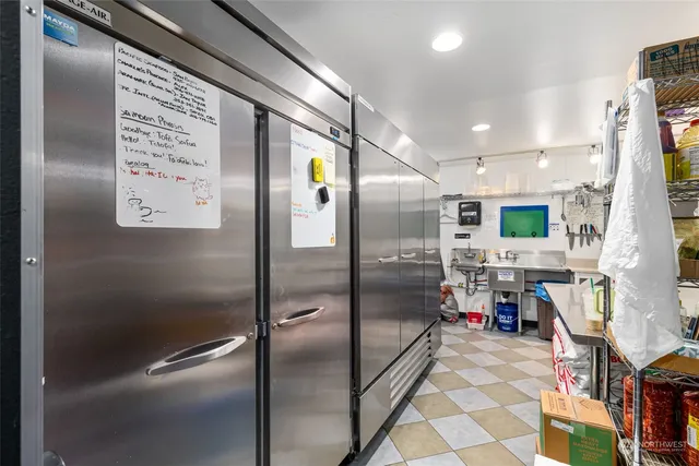 a bedroom with furniture and a book shelf