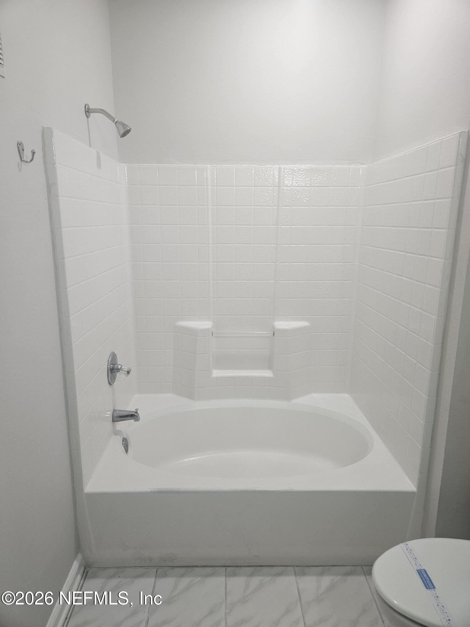 10550 Baymeadows Road, Unit 323 Jacksonville, FL 32256 - Photo 24 of 50 a bathroom with a bathtub and a toilet