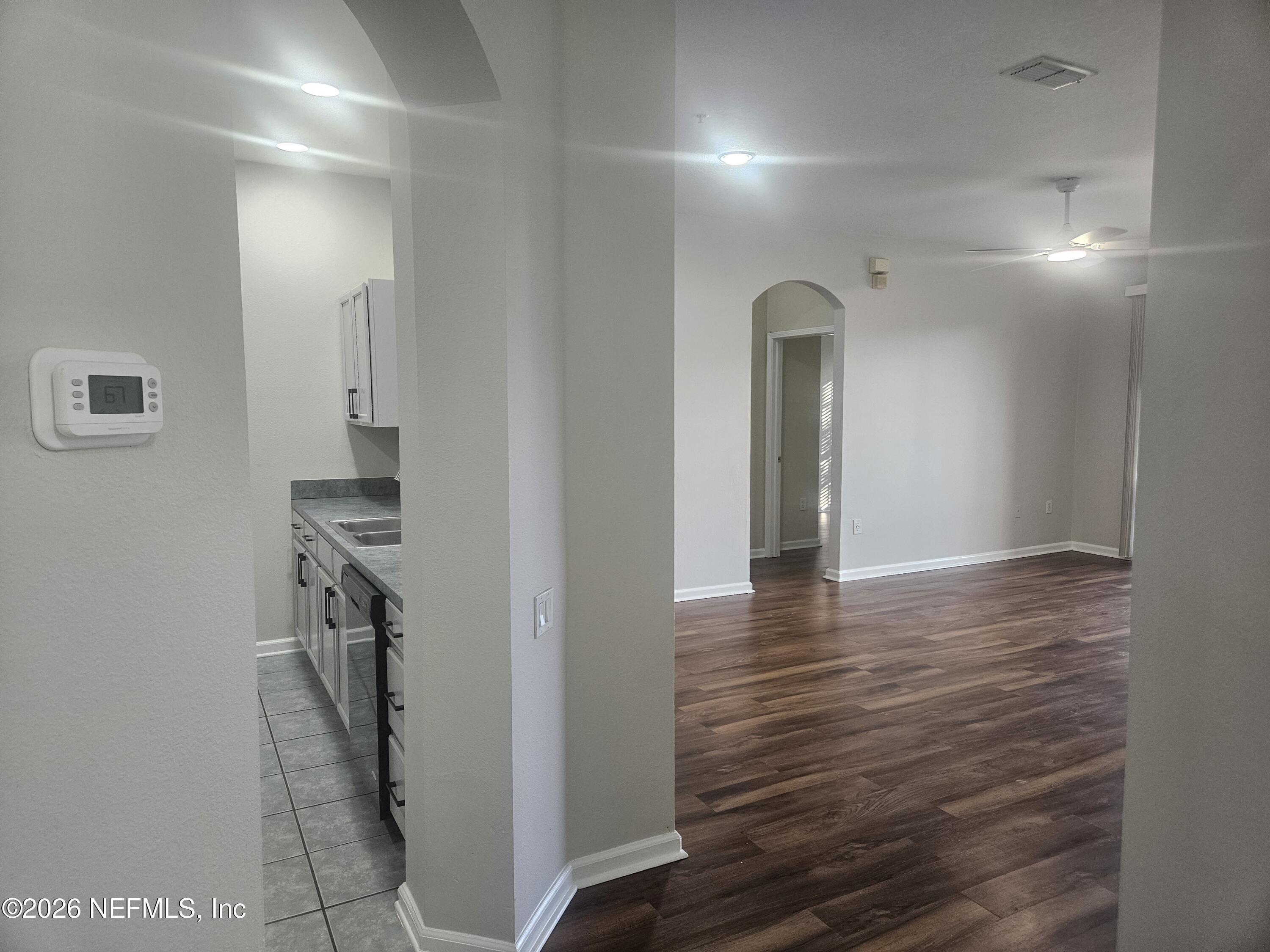 10550 Baymeadows Road, Unit 323 Jacksonville, FL 32256 - Photo 3 of 50 a view of a hallway with wooden floor
