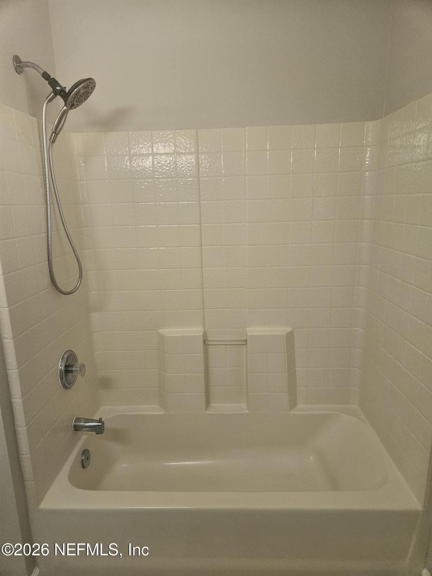 10550 Baymeadows Road, Unit 323 Jacksonville, FL 32256 - Photo 33 of 50 a bathroom with a bath tub with a shower
