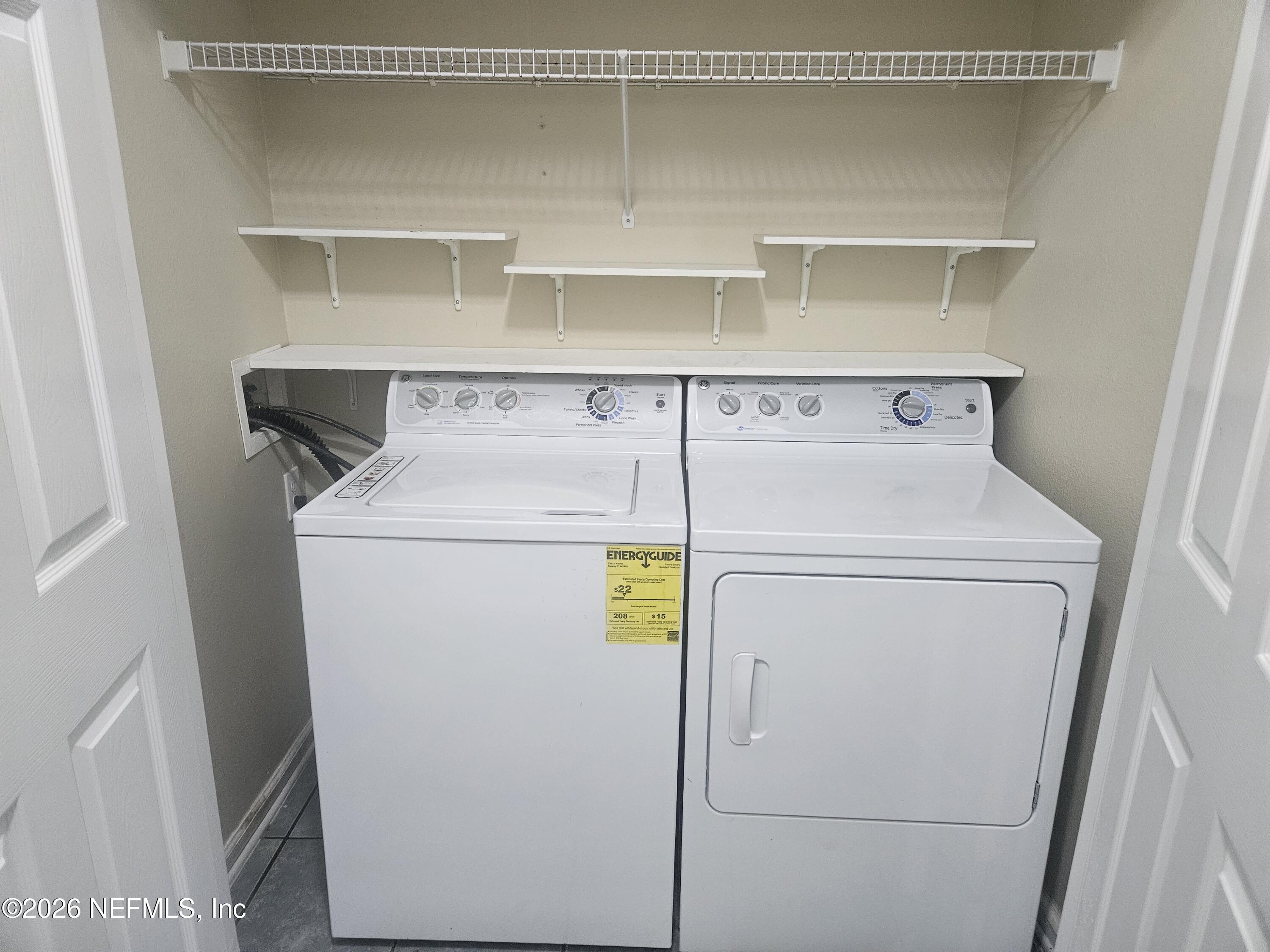 10550 Baymeadows Road, Unit 323 Jacksonville, FL 32256 - Photo 36 of 50 a utility room with dryer and washer