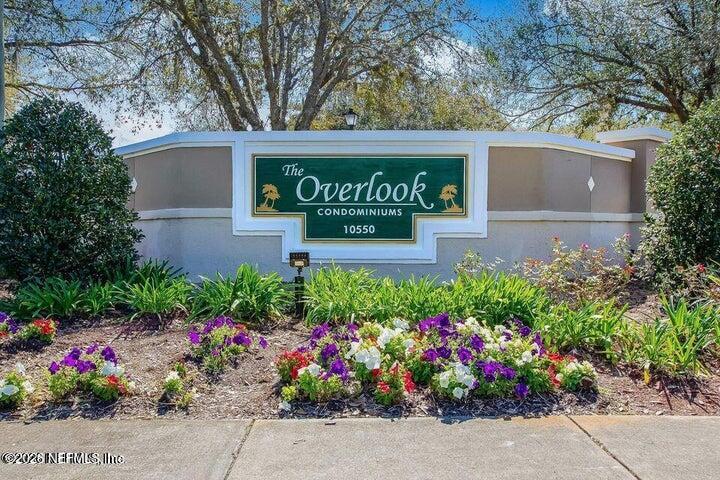 10550 Baymeadows Road, Unit 323 Jacksonville, FL 32256 - Photo 40 of 50 a sign that is in front of flowers