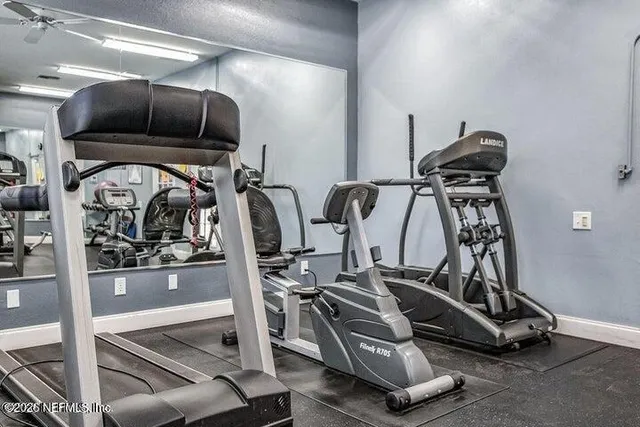 swimming pool view with a seating space and garden view
